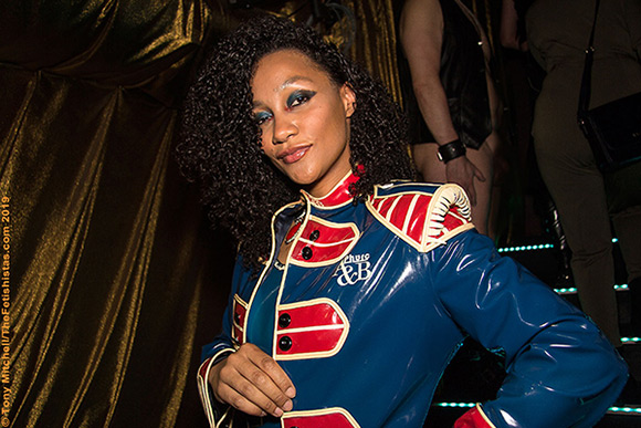 GFB 2019 MC Leigh Hutchinson in one of her custom latex outfits by Phurc