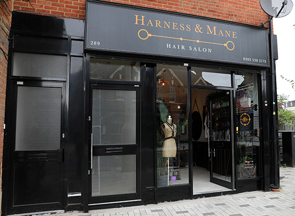 HARNESS & MANE frontage offers some subtle hints that this might not be yer ordinary hair salon